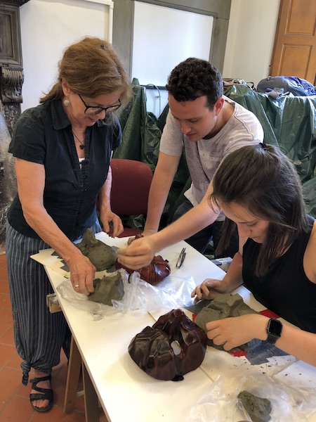 Joan Hartman working with the Commedia dell'Arte students to create original masks.